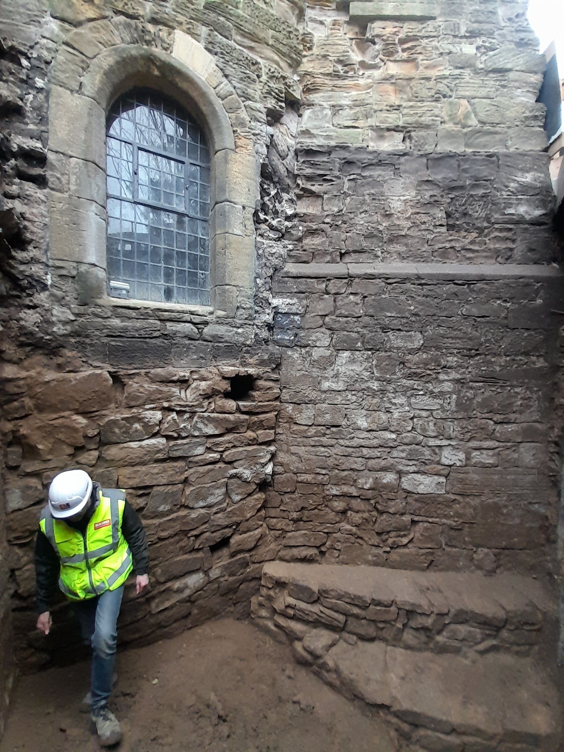 Stonework uncovered by digging the trench to the exterior of the Norma Chapel