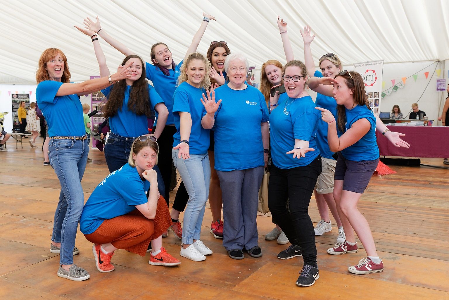 DUVO Volunteers smiling wearing blue T shirts