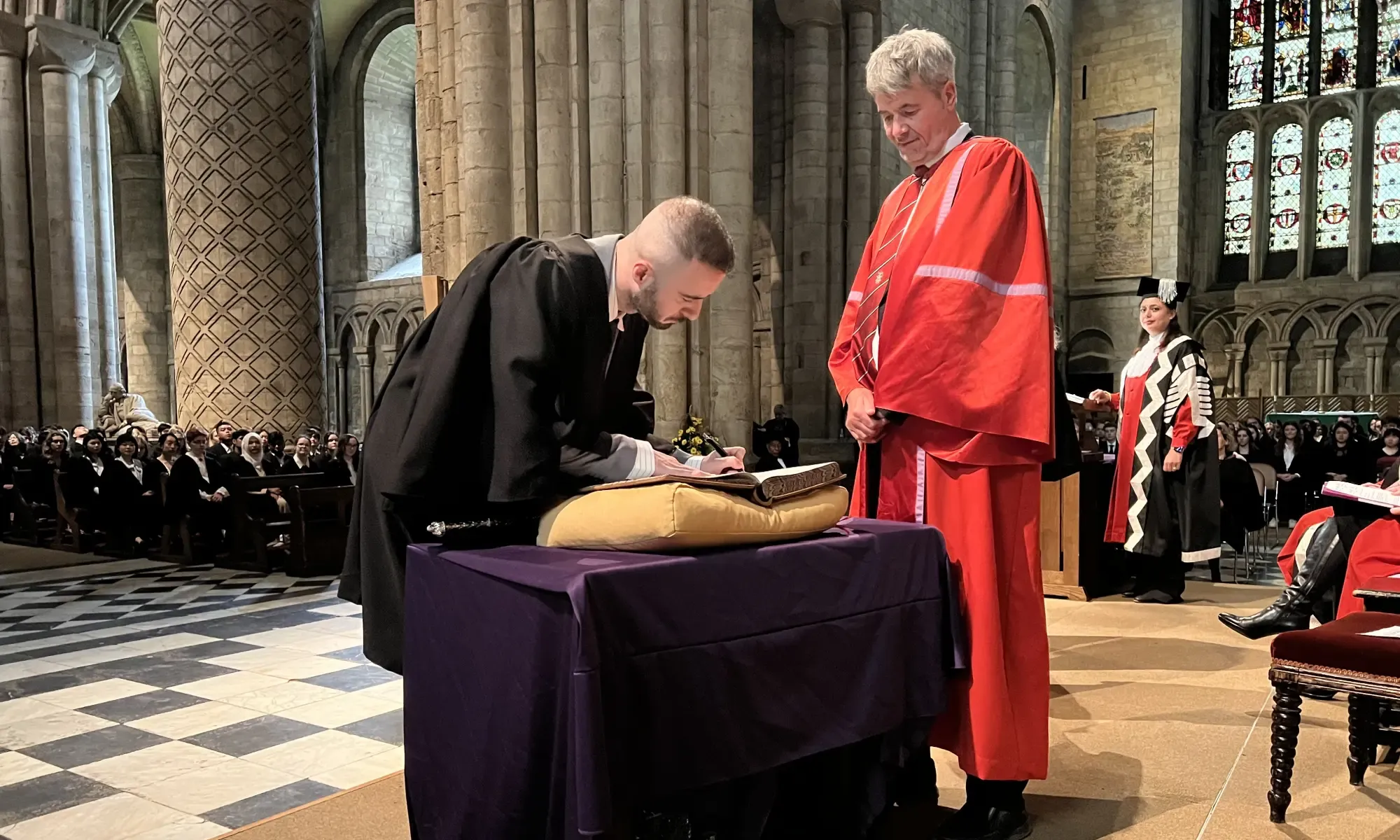 Collingwood College Student Representative signing the Matriculation Book