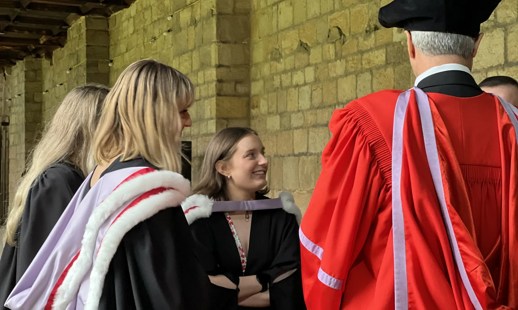 Students and Staff Gathering in Durham Cathedral Cloisters During Matriculation