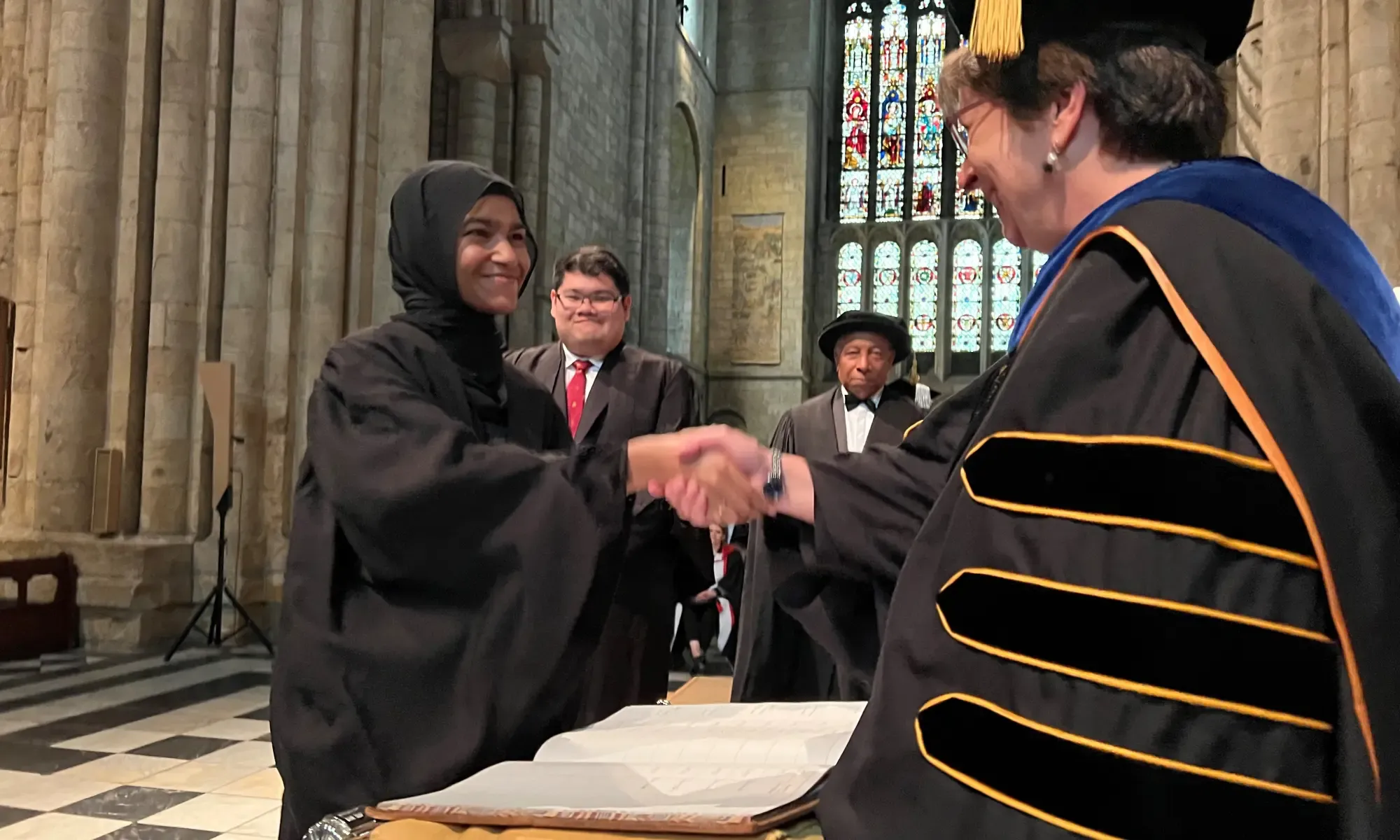 University College Student Representative signing the Matriculation Book