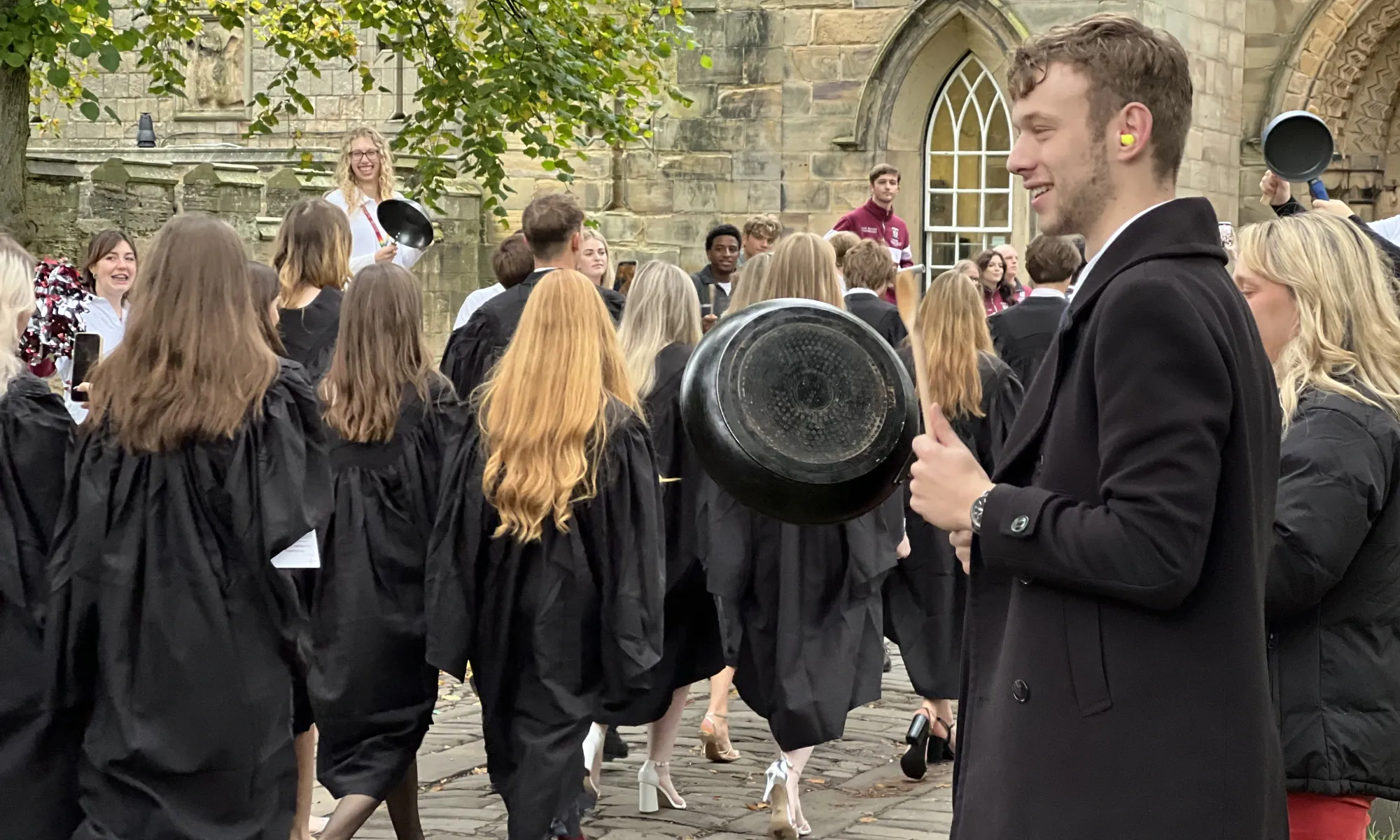 University College students banging pots and pans to welcome new students