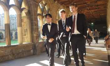 Students walking in the cloisters