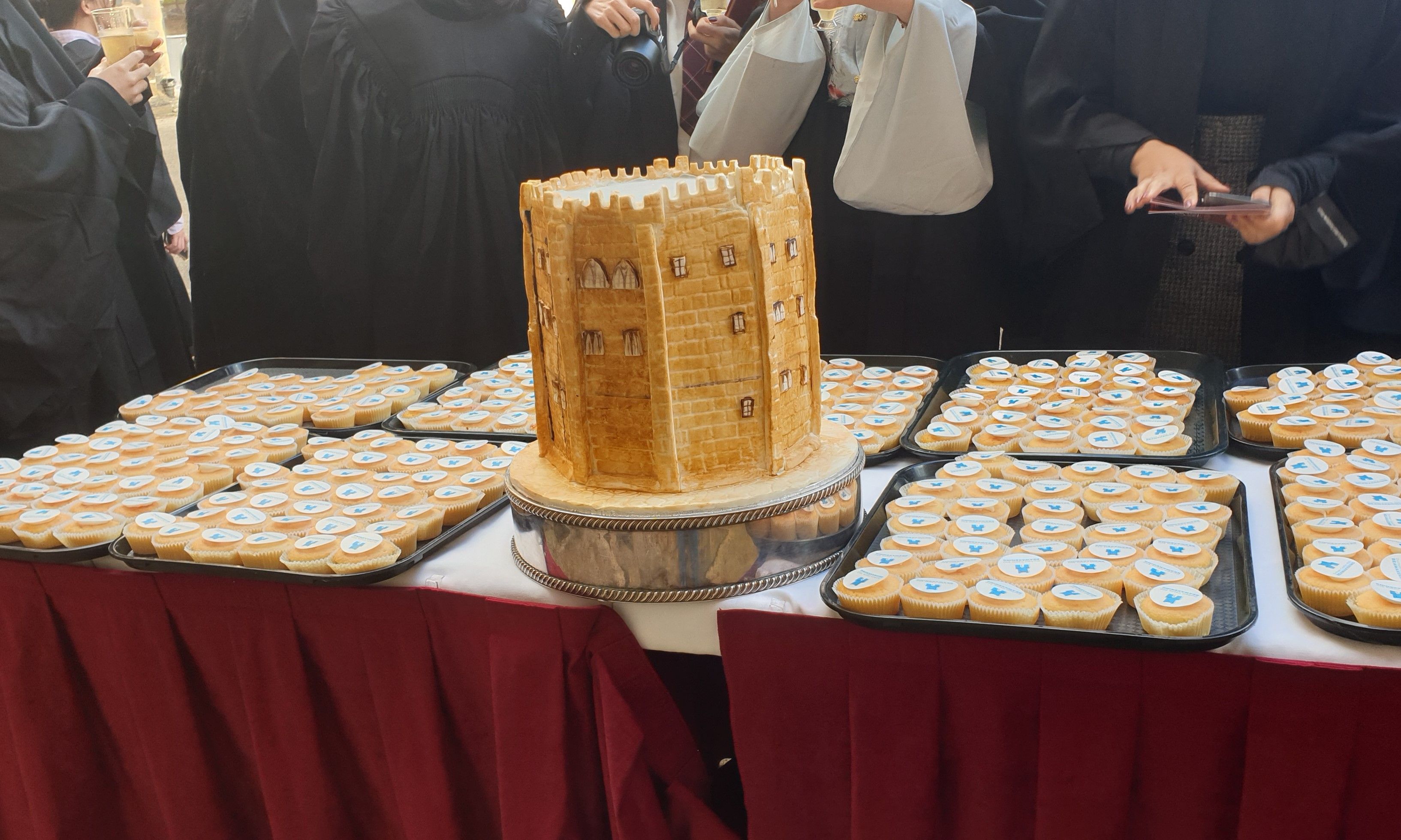 University College celebrating with Castle-themed cake during Matriculation 2022
