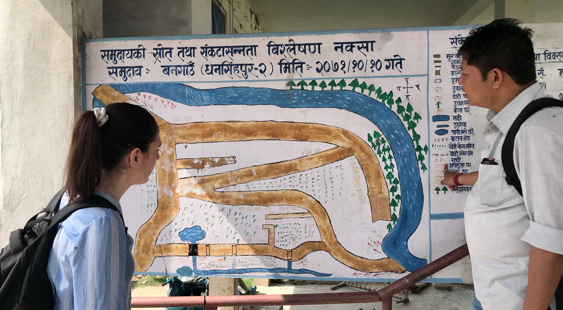 Eleftheria Vavadaki and Bikram Rana consider where the local community was flooded.