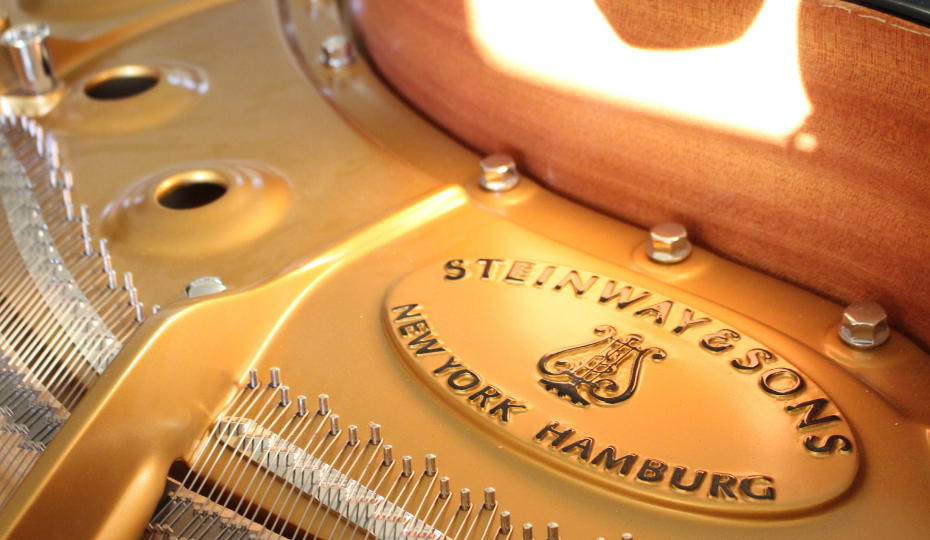 The Steinway brand on a piano